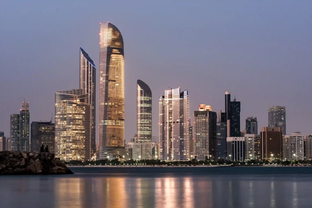 Abu Dhabi skyline with modern skyscrapers at dusk
