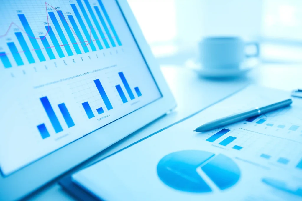 Tablet and pen displaying market research charts and graphs