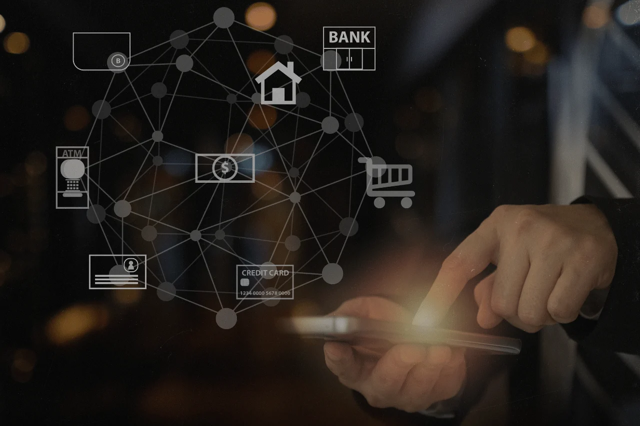 Hand using a smartphone with digital banking and finance network icons overlay.