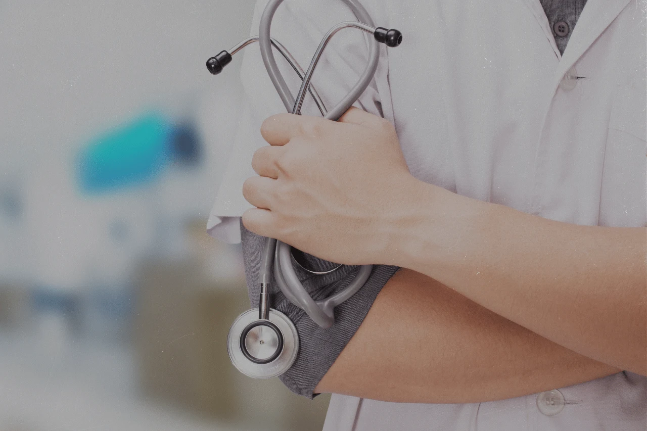 Doctor holding a stethoscope, symbolizing healthcare and medical services.